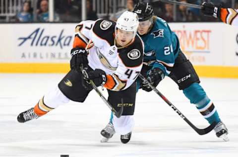 SAN JOSE, CA: Hampus Lindholm #47 of the Anaheim Ducks and Marcus Sorensen #20 of the San Jose Sharks battle for control of the puck during the first period in Game 3 of the 2018 Western Conference First Round on April 16, 2018. (Photo by Thearon W. Henderson/Getty Images)