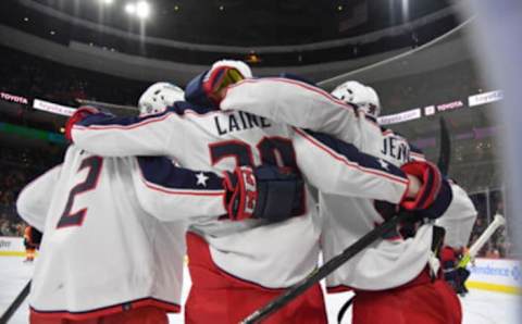 Jan 20, 2022; Philadelphia, Pennsylvania, USA; Columbus Blue Jackets left wing Patrik Laine (29) celebrates his goal with defenseman Andrew Peeke (2) and center Boone Jenner (38) against the Philadelphia Flyers during the third period at Wells Fargo Center. Mandatory Credit: Eric Hartline-USA TODAY Sports