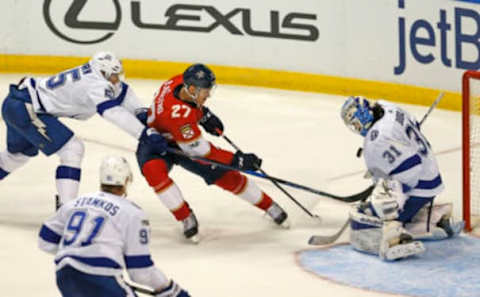 The Florida Panthers’ Nick Bjugstad (27) attempts a shot as Tampa Bay Lightning goalie Peter Budaj (31).