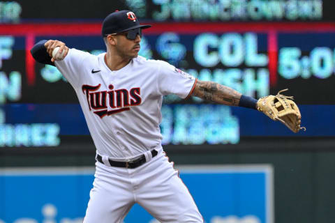 May 28, 2022; Minneapolis, Minnesota, USA; Minnesota Twins shortstop Carlos Correa (4) throws to first base for a force out against the Kansas City Royals during the first inning at Target Field. Mandatory Credit: Nick Wosika-USA TODAY Sports