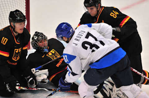 Finland’s forward Jarkko Ruutu (37) vies for the puck at the German goal during the Men’s preliminary Ice Hockey match Finland against Germany at the XXI Winter Olympic games in Vancouver’s Canada Hockey Place on February 19, 2010. Finland won 5-0. AFP PHOTO / CRIS BOURONCLE (Photo credit should read CRIS BOURONCLE/AFP via Getty Images)