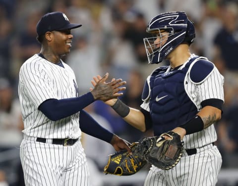 NEW YORK, NY – MAY 25: Pitcher Aroldis Chapman #54 of the New York Yankees celebrates with catcher Gary Sanchez after Chapman struck out Martin Maldonado of the Los Angeles Angels for the last out of the game to gain a save in an MLB baseball game on May 25, 2018 at Yankee Stadium in the Bronx borough of New York City. Yankees won 2-1. (Photo by Paul Bereswill/Getty Images)