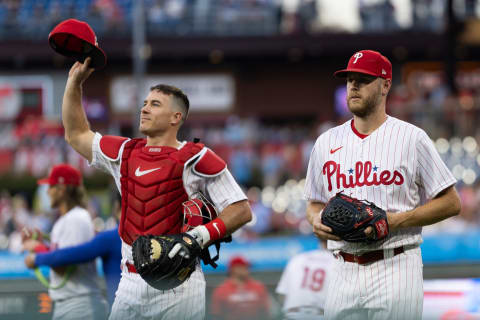 Sep 12, 2023; Philadelphia, Pennsylvania, USA; Philadelphia Phillies catcher J.T. Realmuto (10) and starting pitcher Zack Wheeler (45) take the field for action against the Atlanta Braves at Citizens Bank Park. Mandatory Credit: Bill Streicher-USA TODAY Sports