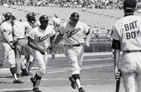 (Original Caption) Minneapolis: Twins’ Harmon Killebrew (right) is congratulated by teammate Tony Oliva after socking a two run homer, his 38th of the season, during the 3rd inning of the Minnesota Washington game.