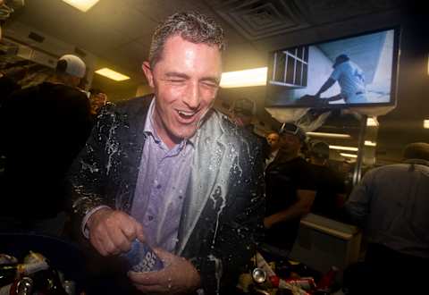 CHICAGO, IL – OCTOBER 2: General Manager Jeff Bridich of the Colorado Rockies celebrates in the clubhouse after defeating the Chicago Cubs 2-1 in the National League Wild Card game at Wrigley Field on Tuesday, October 2, 2018 in Chicago, Illinois. (Photo by Alex Trautwig/MLB Photos via Getty Images)