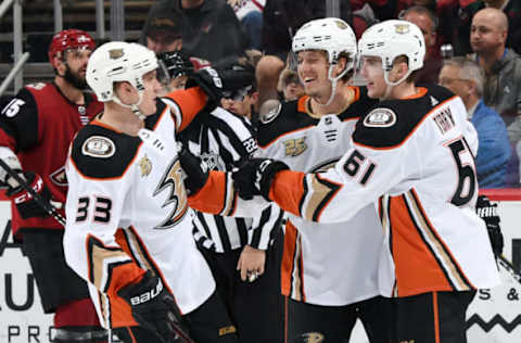 GLENDALE, AZ – MARCH 05: Troy Terry #61 of the Anaheim Ducks celebrates with teammates Rickard Rakell #67 and Jakob Silfverberg #33 after scoring a goal against the Arizona Coyotes during the third period at Gila River Arena on March 5, 2019, in Glendale, Arizona. (Photo by Norm Hall/NHLI via Getty Images)