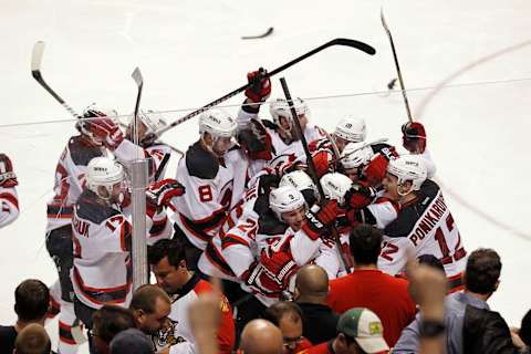 New Jersey Devils celebrate their double overtime win. (Photo by Joel Auerbach/Getty Images)