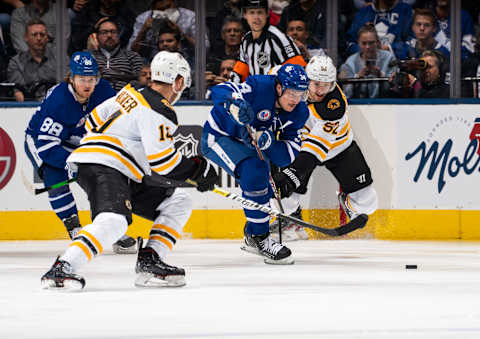 TORONTO, ON – NOVEMBER 15: Auston Matthews #34 of the Toronto Maple Leafs battles for the puck against Sean Kuraly #52 of the Boston Bruins during the second period at the Scotiabank Arena on November 15, 2019 in Toronto, Ontario, Canada. (Photo by Mark Blinch/NHLI via Getty Images)