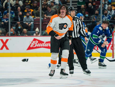 Oct 28, 2021; Vancouver, British Columbia, CAN; Philadelphia Flyers forward Zack MacEwen (17) fights with Vancouver Canucks defenseman Luke Schenn (2) in the second period at Rogers Arena. Mandatory Credit: Bob Frid-USA TODAY Sports