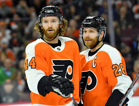 Mar 12, 2018; Philadelphia, PA, USA; Sean Couturier (14) and Claude Giroux (28) Mandatory Credit: Eric Hartline-USA TODAY Sports