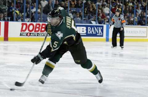 ST. LOUIS – JANUARY 25: Darryl Sydor #5 of the Dallas Stars shoots against the St. Louis Blues at the Savvis Center on January 25, 2003 in St. Louis, Missouri. The Stars defeated the Blues 4-2. (Photo by Elsa/Getty Images/NHLI)