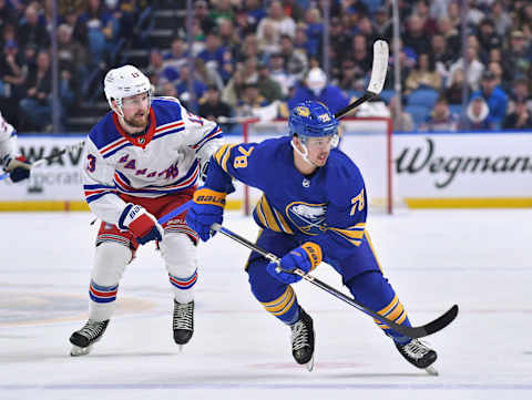 Mar 31, 2023; Buffalo, New York, USA; Buffalo Sabres defenseman Jacob Bryson (78) and New York Rangers left wing Alexis Lafrenière (13) skate after the puck in the second period at KeyBank Center. Mandatory Credit: Mark Konezny-USA TODAY Sports