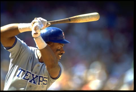 30 Jun 1991: JULIO FRANCO OF THE TEXAS RANGERS IN HIS WELL-KNOWN, BAT-OVER-THE-HEAD BATTING STANCE DURING THEIR GAME AGAINST THE CALIFORNIA ANGELS AT ANAHEIM STADIUM IN ANAHEIM, CALIFORNIA.