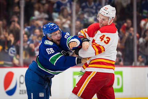 Sep 25, 2022; Vancouver, British Columbia, CAN; Calgary Flames forward Adam Klapka (43) fights with Vancouver Canucks Vincent Arseneau (68) in the third period at Rogers Arena. Calgary won 3-2 in overtime. Mandatory Credit: Bob Frid-USA TODAY Sports