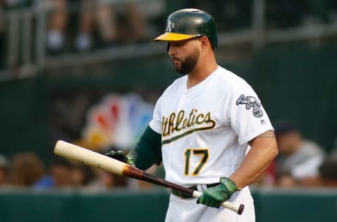 Jun 19, 2017; Oakland, CA, USA; Oakland Athletics first baseman Yonder Alonso (17) examines his bat in the fourth inning against the Houston Astros at Oakland Coliseum. Mandatory Credit: Stan Szeto-USA TODAY Sports