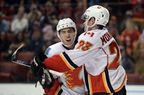 November 6, 2016; Anaheim, CA, USA; Calgary Flames left wing Johnny Gaudreau (13) and center Sean Monahan (23) celebrate the goal scored by right wing Alex Chiasson (39) against the Anaheim Ducks during the first period at Honda Center. Monahan and Gaudreau each provided an assist on the goal. Mandatory Credit: Gary A. Vasquez-USA TODAY Sports