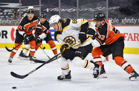 Feb 3, 2021; Philadelphia, Pennsylvania, USA; Boston Bruins right wing David Pastrnak (88) controls the puck against Philadelphia Flyers defenseman Shayne Gostisbehere (53) during the third period at Wells Fargo Center. Mandatory Credit: Eric Hartline-USA TODAY Sports