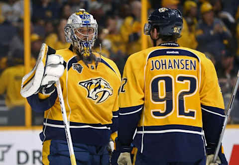 Nashville Predators goalie Pekka Rinne (35) talks with teammate center Ryan Johansen (92) during a stop in play. The Predators won 4-3. Mandatory Credit: Aaron Doster-USA TODAY Sports