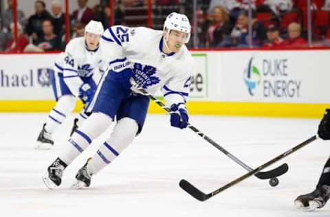 Feb 19, 2017; Raleigh, NC, USA; Toronto Maple Leafs forward James van Riemsdyk (25) skates with the puck against the Carolina Hurricanes at PNC Arena. The Toronto Maple Leafs defeat the Carolina Hurricanes 4-0. Mandatory Credit: James Guillory-USA TODAY Sports