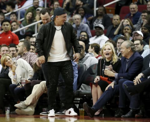 HOUSTON, TX – DECEMBER 11: Alex Bregman of the Houston Astros reacts after PJ Tucker #17 of the Houston Rockets crashed into him while diving for a loose ball in the first half against the Portland Trail Blazers at Toyota Center on December 11, 2018 in Houston, Texas. NOTE TO USER: User expressly acknowledges and agrees that, by downloading and or using this photograph, User is consenting to the terms and conditions of the Getty Images License Agreement. (Photo by Tim Warner/Getty Images)