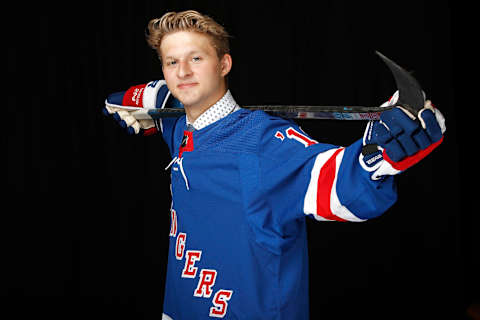 Zachary Jones reacts after being selected 68th overall by the New York Rangers