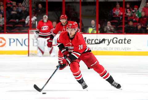 RALEIGH, NC – MARCH 13: Sebastian Aho #20 of the Carolina Hurricanes moves the puck on the ice during an NHL game against the Boston Bruins on March 13, 2018 at PNC Arena in Raleigh, North Carolina. (Photo by Gregg Forwerck/NHLI via Getty Images)