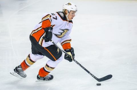 Feb 15, 2016; Calgary, Alberta, CAN; Anaheim Ducks defenseman Hampus Lindholm (47) controls the puck against the Calgary Flames during the third period at Scotiabank Saddledome. Anaheim Ducks won 6-4. Mandatory Credit: Sergei Belski-USA TODAY Sports