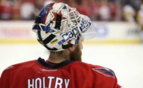 Washington Capitals goalie Braden Holtby (70) kneels on the ice (Geoff Burke-USA TODAY Sports)