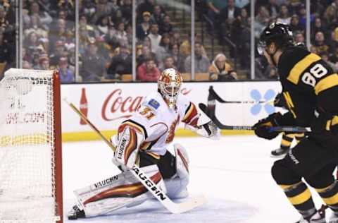 Nov 25, 2016; Boston, MA, USA; Calgary Flames goalie Chad Johnson (31) makes a skate save on Boston Bruins right wing David Pastrnak (88) during the first period at TD Garden. Mandatory Credit: Bob DeChiara-USA TODAY Sports