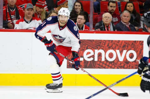 Jan 8, 2016; Raleigh, NC, USA; Columbus Blue Jackets defensemen Fedor Tyutin (51) skates with the puck against the Carolina Hurricanes at PNC Arena. The Carolina Hurricanes defeated the Columbus Blue Jackets 4-1. Mandatory Credit: James Guillory-USA TODAY Sports