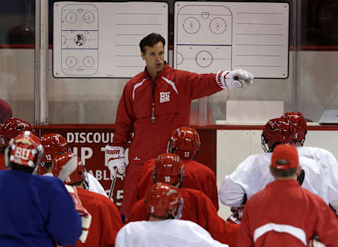 BOSTON – OCTOBER 9: Boston University ice hockey head coach Coach David Quinn speaks with team on October 9, 2013. (Photo by Barry Chin/The Boston Globe via Getty Images)