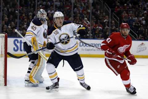 Jan 22, 2016; Buffalo, NY, USA; Buffalo Sabres defenseman Rasmus Ristolainen (55) and Detroit Red Wings center Luke Glendening (41) look for the puck during the third period at First Niagara Center. Detroit beats Buffalo 3 to 0. Mandatory Credit: Timothy T. Ludwig-USA TODAY Sports