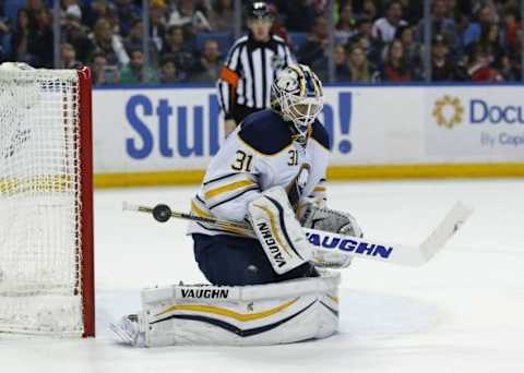 Jan 16, 2016; Buffalo, NY, USA; Buffalo Sabres goalie Chad Johnson (31) makes a save during the third period against the Washington Capitals at First Niagara Center. Sabres beat the Capitals 4-1. Mandatory Credit: Kevin Hoffman-USA TODAY Sports