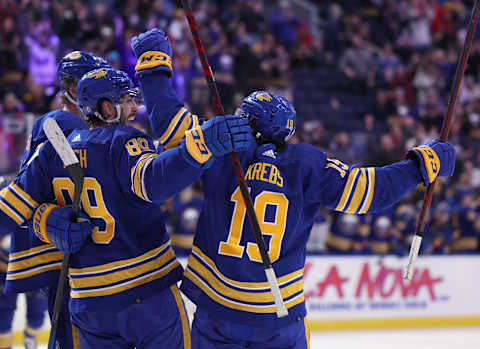 Feb 15, 2022; Buffalo, New York, USA; Buffalo Sabres right wing Alex Tuch (89) celebrates with center Peyton Krebs (19) after scoring a goal against the New York Islanders during the second period at KeyBank Center. Mandatory Credit: Timothy T. Ludwig-USA TODAY Sports