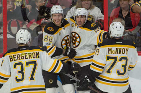 Apr 12, 2017; Ottawa, Ontario, CAN; Boston Bruins left wing Brad Marchand (63) celebrates with teammates after scoring a goal against the Ottawa Senators in the third period as part of game one of the first round of the 2017 Stanley Cup Playoffs at Canadian Tire Centre. The Bruins won 2-1. Mandatory Credit: Marc DesRosiers-USA TODAY Sports