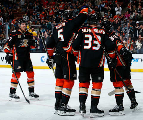 ANAHEIM, CA – APRIL 5: Hampus Lindholm #47, Korbinian Holzer #5, Jakob Silfverberg #33, and Sam Steel #34 of the Anaheim Ducks celebrate a third period goal during the game against the Los Angeles Kings on April 5, 2019, at Honda Center in Anaheim, California. (Photo by Debora Robinson/NHLI via Getty Images)