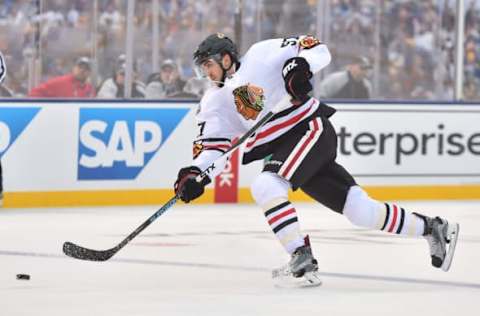 Jan 2, 2017; St. Louis, MO, USA; Chicago Blackhawks defenseman Trevor van Riemsdyk (57) shoots the puck against the St. Louis Blues during the 2016 Winter Classic ice hockey game at Busch Stadium. Mandatory Credit: Jasen Vinlove-USA TODAY Sports