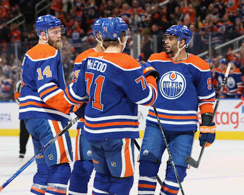 EDMONTON, CANADA – NOVEMBER 26: Mattias Ekholm #14, Evander Kane #91 and Ryan McLeod #71 of the Edmonton Oilers celebrate a power play goal in the third period against the Anaheim Ducks on November 26, 2023 at Rogers Place in Edmonton, Alberta, Canada. (Photo by Lawrence Scott/Getty Images)