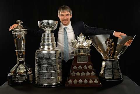 LAS VEGAS, NV – JUNE 20: Alex Ovechkin of the Washington Capitals poses for a portrait with (l-r) the Prince of Wales Trophy, the Stanley Cup trophy, Conne Smythe Trophy and the Maurice “Rocket” Richard Trophy at the 2018 NHL Awards at the Hard Rock Hotel & Casino on June 20, 2018 in Las Vegas, Nevada. (Photo by Brian Babineau/NHLI via Getty Images)