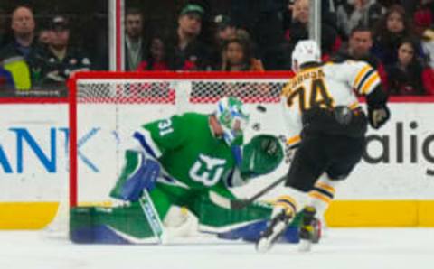 Mar 26, 2023; Raleigh, North Carolina, USA; Boston Bruins left wing Jake DeBrusk (74) scores a shoot out goal past Carolina Hurricanes goaltender Frederik Andersen (31) at PNC Arena. Mandatory Credit: James Guillory-USA TODAY Sports