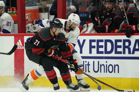 Nino Niederreiter, Carolina Hurricanes, Scott Mayfield, New York Islanders  (Photo by Gregg Forwerck/NHLI via Getty Images)