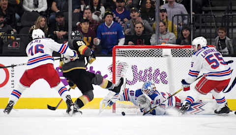 LAS VEGAS, NEVADA – DECEMBER 08: Alexandar Georgiev #40 of the New York Rangers makes a save against William Carrier #28 of the Vegas Golden Knights as Brady Skjei #76 and Ryan Lindgren #55 of the Rangers defend in the first period of their game at T-Mobile Arena on December 8, 2019 in Las Vegas, Nevada. The Rangers defeated the Golden Knights 5-0. (Photo by Ethan Miller/Getty Images)