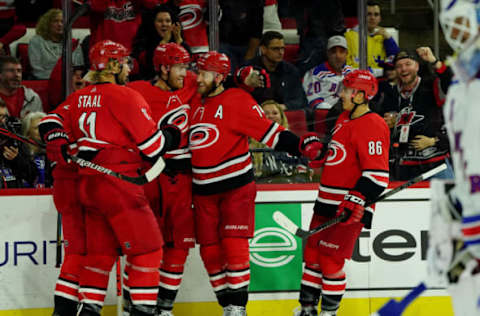 RALEIGH, NC – NOVEMBER 7: Dougie Hamilton #19 of the Carolina Hurricanes celebrates with teammates after scoring a goal during an NHL game against the New York Rangers on November 7, 2019 at PNC Arena in Raleigh, North Carolina. (Photo by Gregg Forwerck/NHLI via Getty Images)