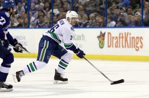 Dec 22, 2015; Tampa, FL, USA; Vancouver Canucks right wing Jannik Hansen (36) shoots against the Tampa Bay Lightning during the first period at Amalie Arena. Mandatory Credit: Kim Klement-USA TODAY Sports