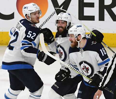 Jack Roslovic, Mathieu Perreault and Bryan Little of the Winnipeg Jets (Photo by Ethan Miller/Getty Images)