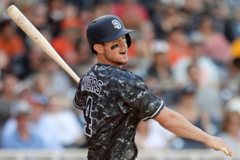 Sep 24, 2016; San Diego, CA, USA; San Diego Padres first baseman Wil Myers (4) hits the go ahead RBI single during the seventh inning of a 4-3 win over the San Francisco Giants at Petco Park. Mandatory Credit: Jake Roth-USA TODAY Sports