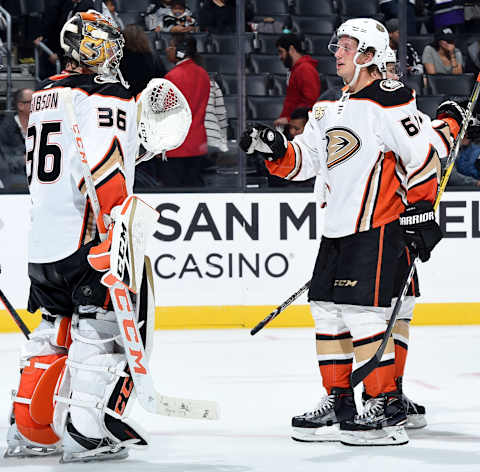 LOS ANGELES, CA – SEPTEMBER 29: Goaltender John Gibson #36 and Rickard Rakell #67 of the Anaheim Ducks celebrate after defeating the Los Angeles Kings 3-0 in the preseason game at STAPLES Center on September 29, 2018 in Los Angeles, California. (Photo by Juan Ocampo/NHLI via Getty Images)