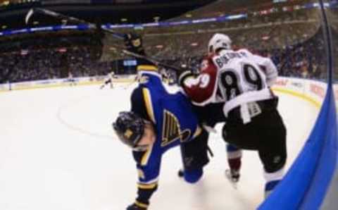 Mar 29, 2016; St. Louis, MO, USA; Colorado Avalanche left wing Mikkel Boedker (89) checks St. Louis Blues right wing Troy Brouwer (36) during the third period at Scottrade Center.The Blues won 3-1. Mandatory Credit: Jeff Curry-USA TODAY Sports