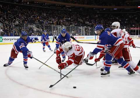 NEW YORK, NEW YORK – NOVEMBER 06: Tyler Bertuzzi #59 of the Detroit Red Wings is stopped by the New York Rangers during the third period at Madison Square Garden on November 06, 2019 in New York City. The Rangers defeated the Red Wings 5-1. (Photo by Bruce Bennett/Getty Images)