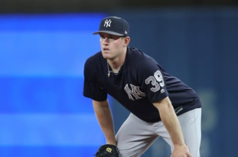 TORONTO, ON – MARCH 31: Billy McKinney #39 of the New York Yankees gets ready during batting practice as he warms up before the start of MLB game action against the Toronto Blue Jays at Rogers Centre on March 31, 2018 in Toronto, Canada. (Photo by Tom Szczerbowski/Getty Images) *** Local Caption *** Billy McKinney